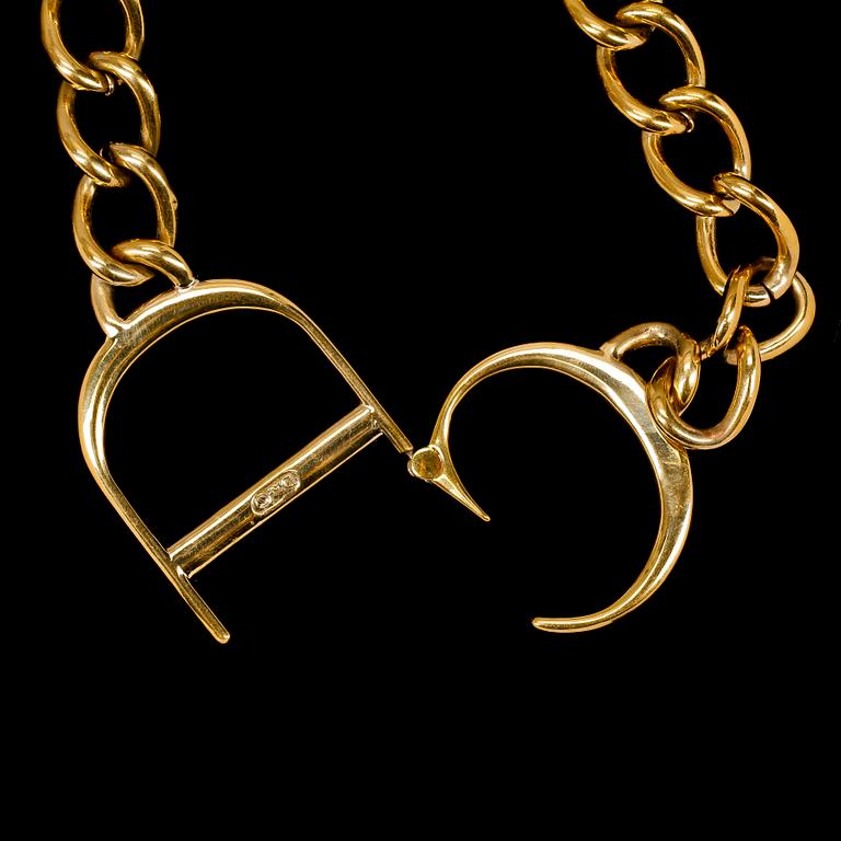 A 1980s golden necklace by Christian Dior.