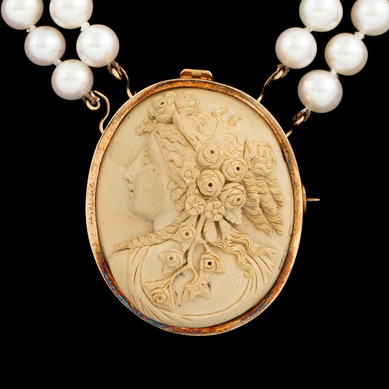 Lava cameo and cultured pearl necklace.