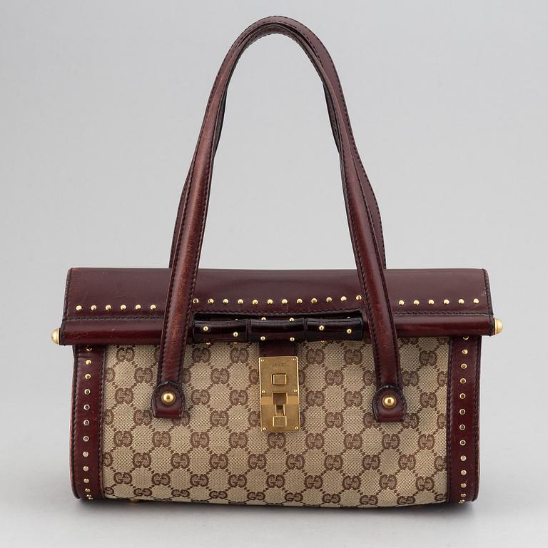 Gucci, a monogram canvas bag.