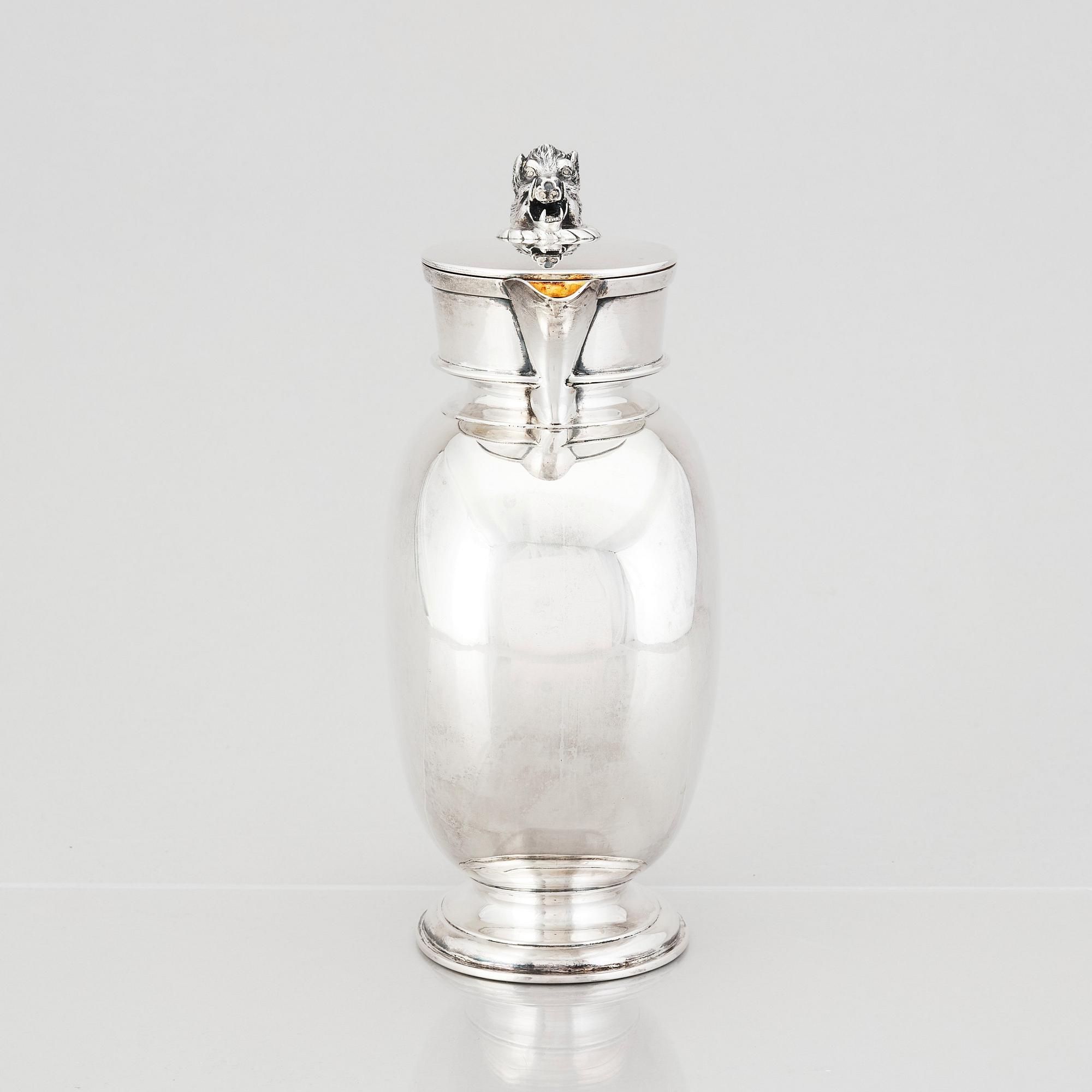 An English silver jug with lid, makers mark Hunt & Roskell Late Storr & Mortimer, London 1881.