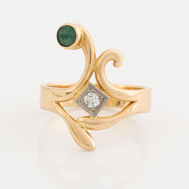 18K gold brilliant cut diamond and  cabochon cut emerald ring.