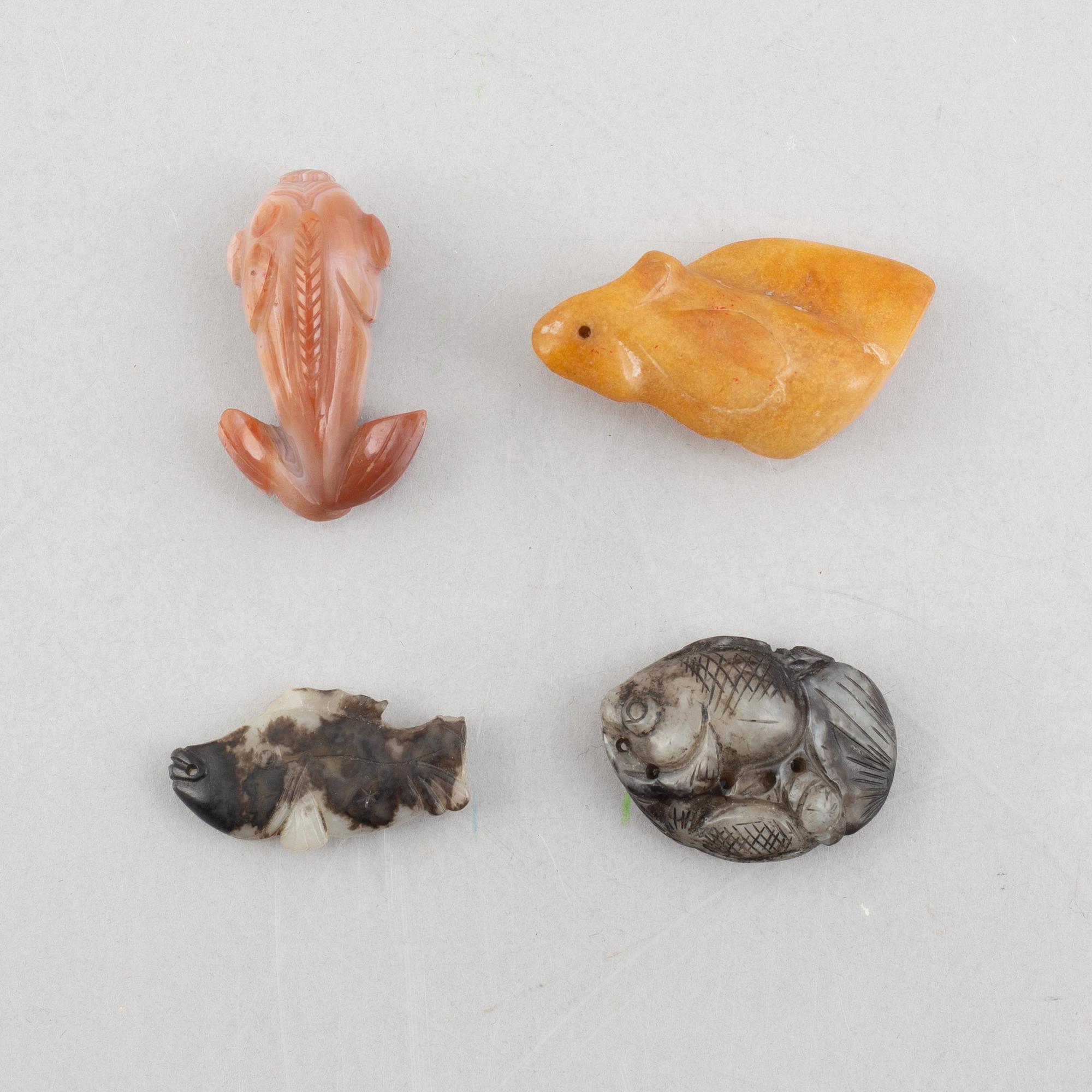 A group of eight Chinese stone charms / pendants, 20th century.