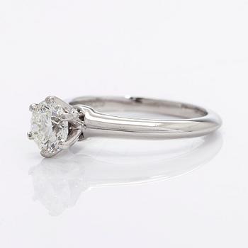 Tiffany & Co, a platinu solitaire ring with a brilliant-cut diamond.
