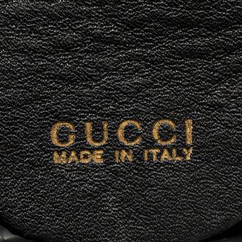 GUCCI, a leather bag/briefcase.