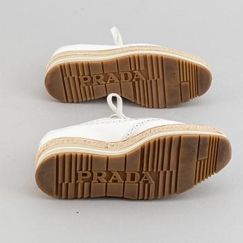 Prada, a pair of white leather brogues, size 36.