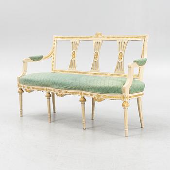 A painted and carved Gustavian style sofa, 1920's.