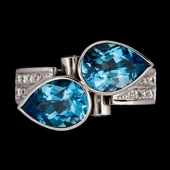 A blue topaz and brilliant cut diamond ring,
