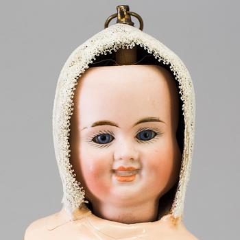 A bisque head multi-face doll, Germany, 1910s.