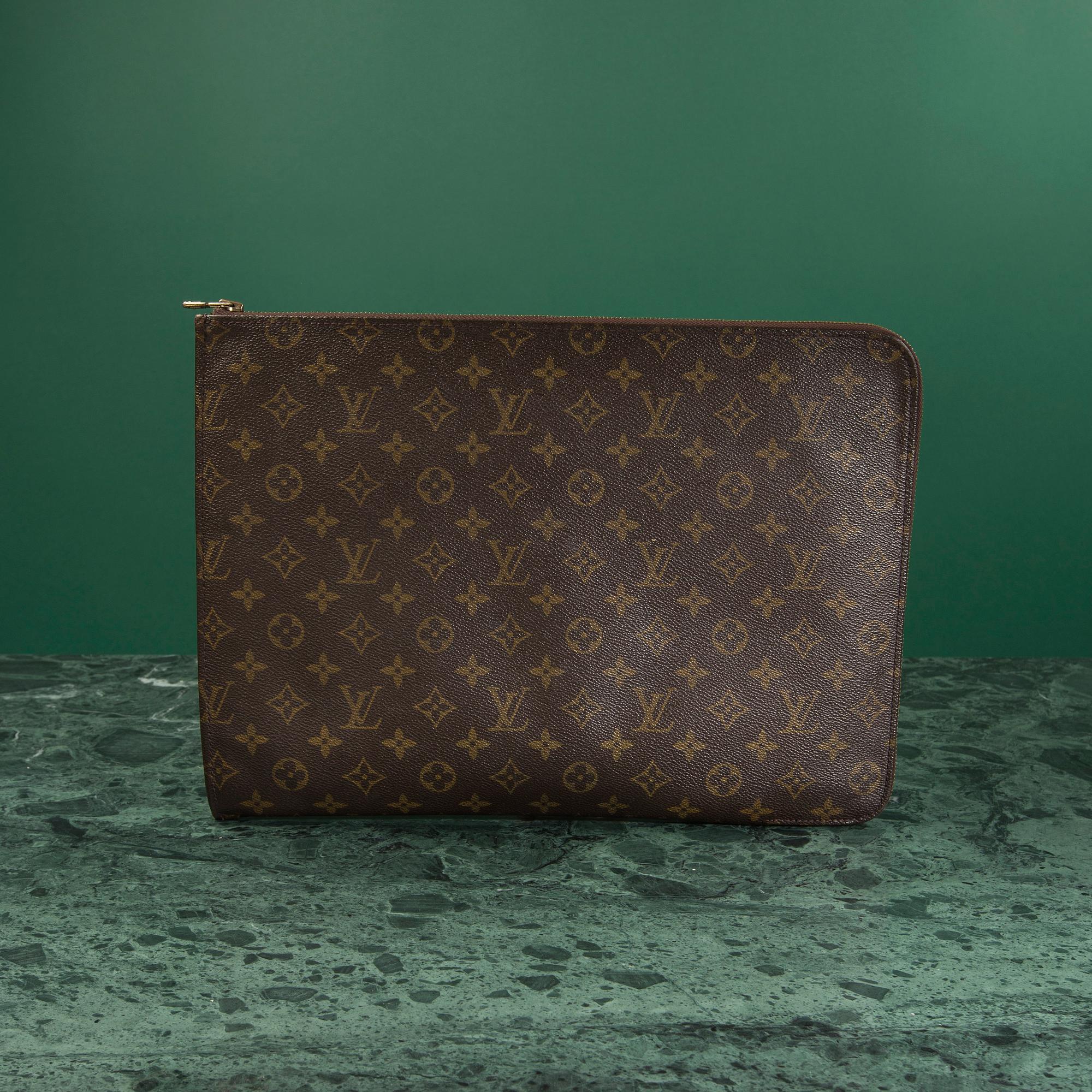 A "Pochette Documents" bag by Louis Vuitton.