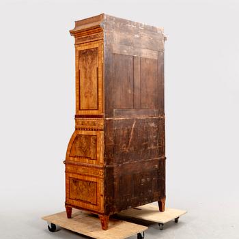 A German walnut and mahogany writing cabinet around 1800.