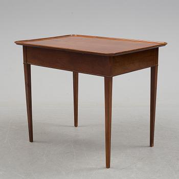 A 19th century mahogany table with drawer.