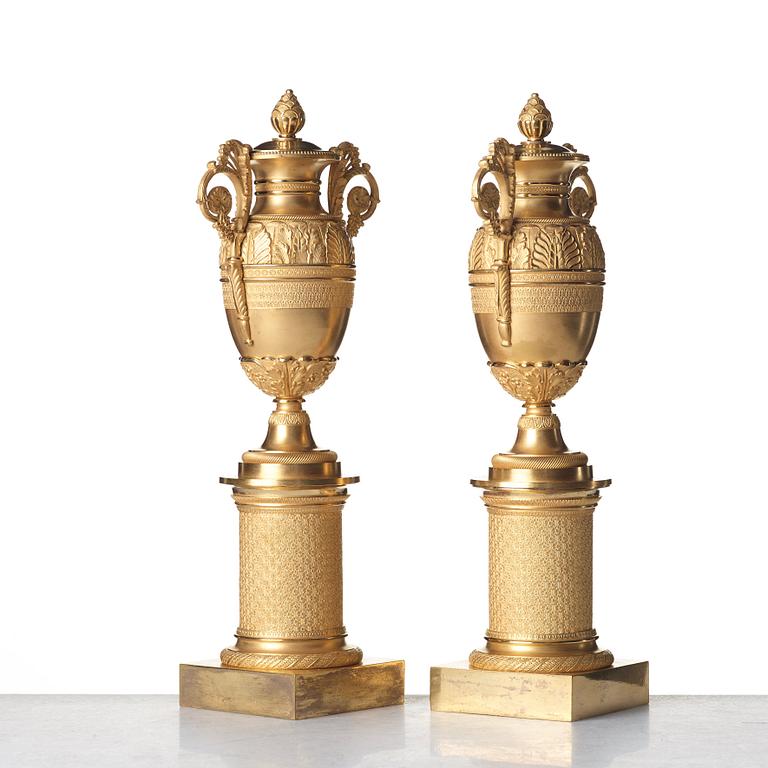 A pair of French Empire candlesticks, early 19th century.