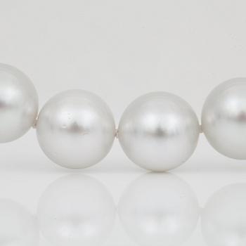 A cultured South Sea pearl necklace, Ø 12-14 mm, with a diamond-set clasp.