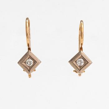A pair of 18K gold earrings with diamonds ca. 0.08 ct in total.