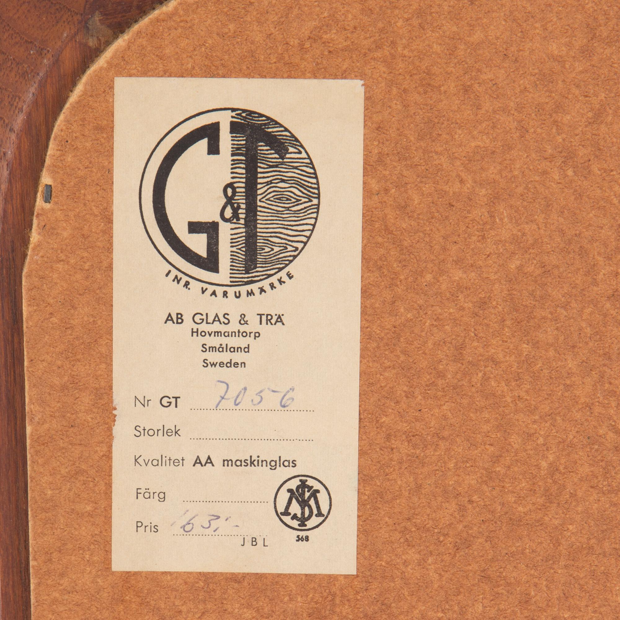 A mid 20th century mirror by G&T.
