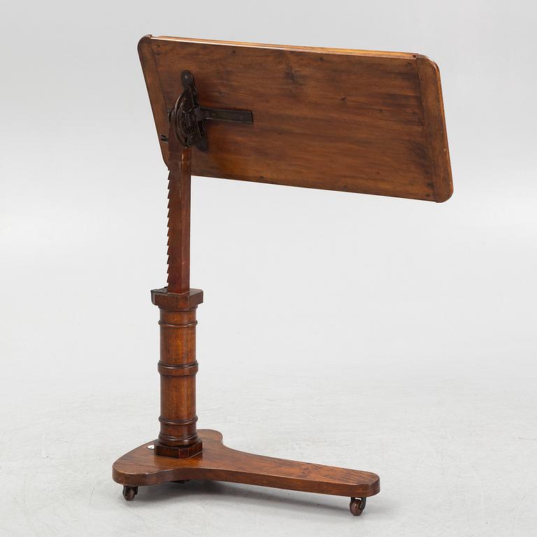 A reading table, J. Carter London, England, circa 1900.