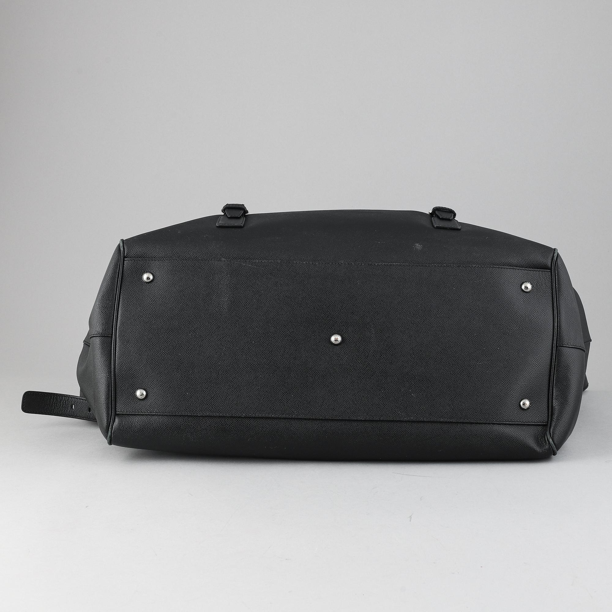 Dolce & Gabbana, a black leather weekend bag.