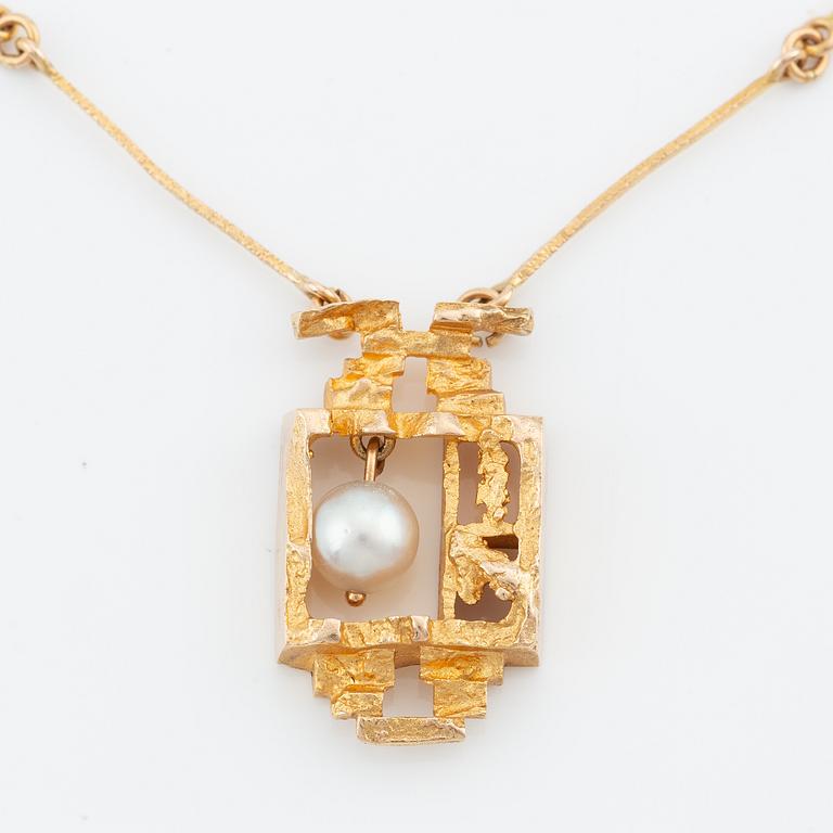 Lapponia, 14K gold necklace with a cultured pearl, designed by Björn Weckström "Magical Pearl".