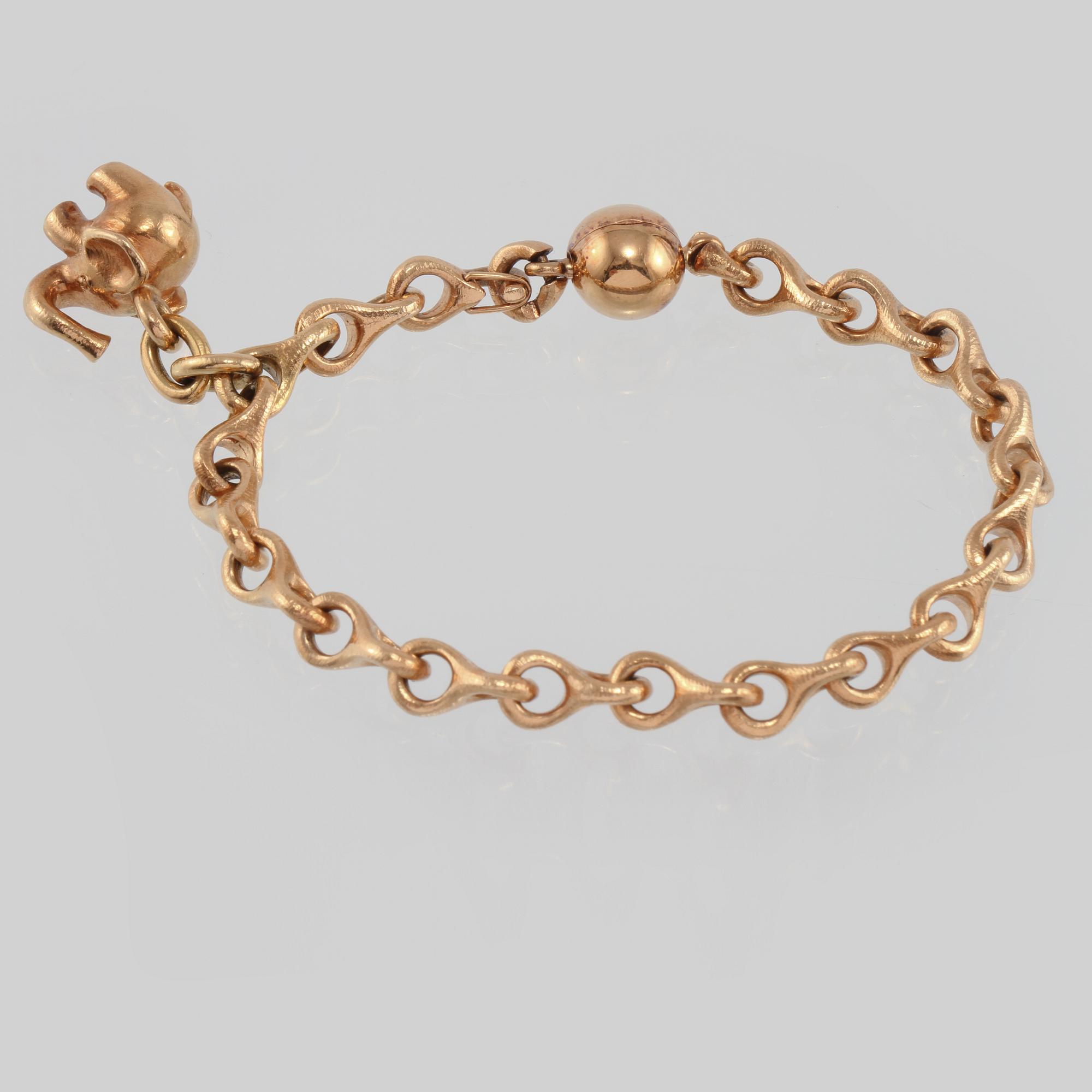ARMBAND, 18K guld, en berlock med briljantslipad diamant, Ole Lynggaard.