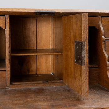 An oak secretaire, around 1800.