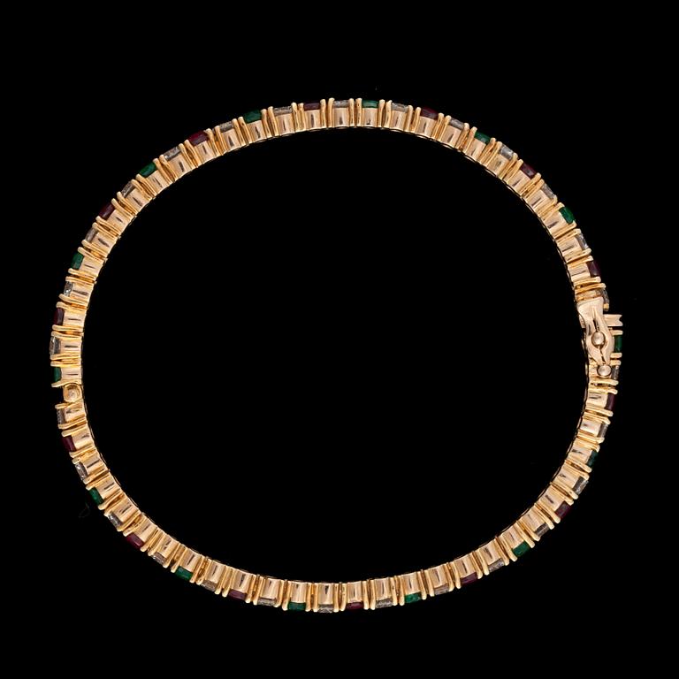 ARMBAND med diamanter totalt ca 4.20 ct samt rubiner och smaragder.