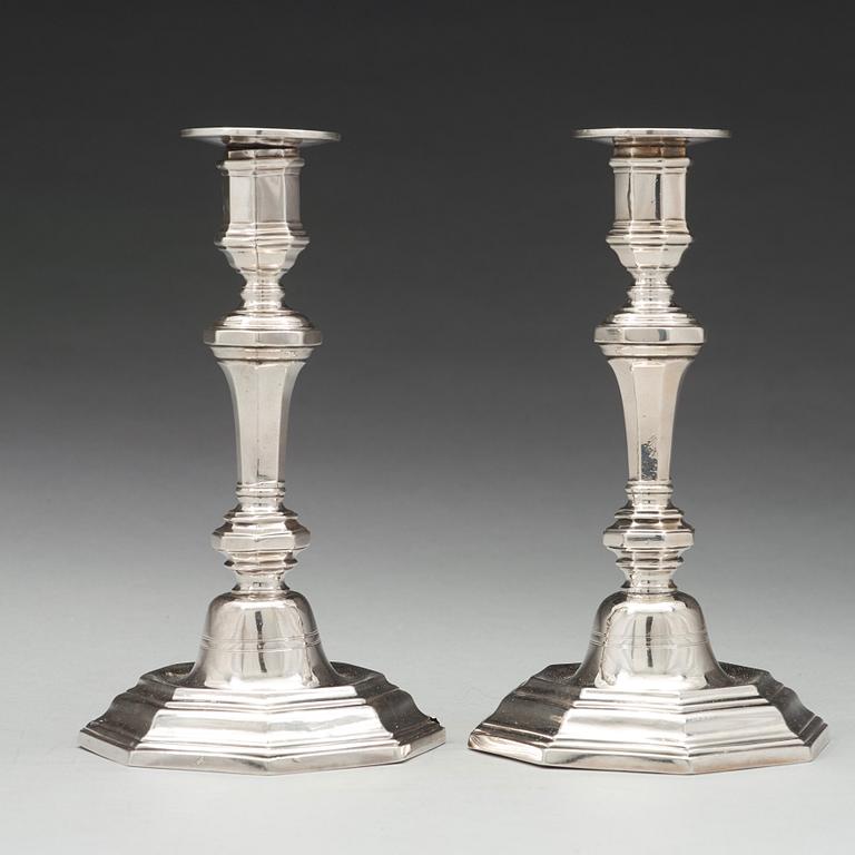 A pair of French 18th century silver candlesticks, unidentified makers mark.