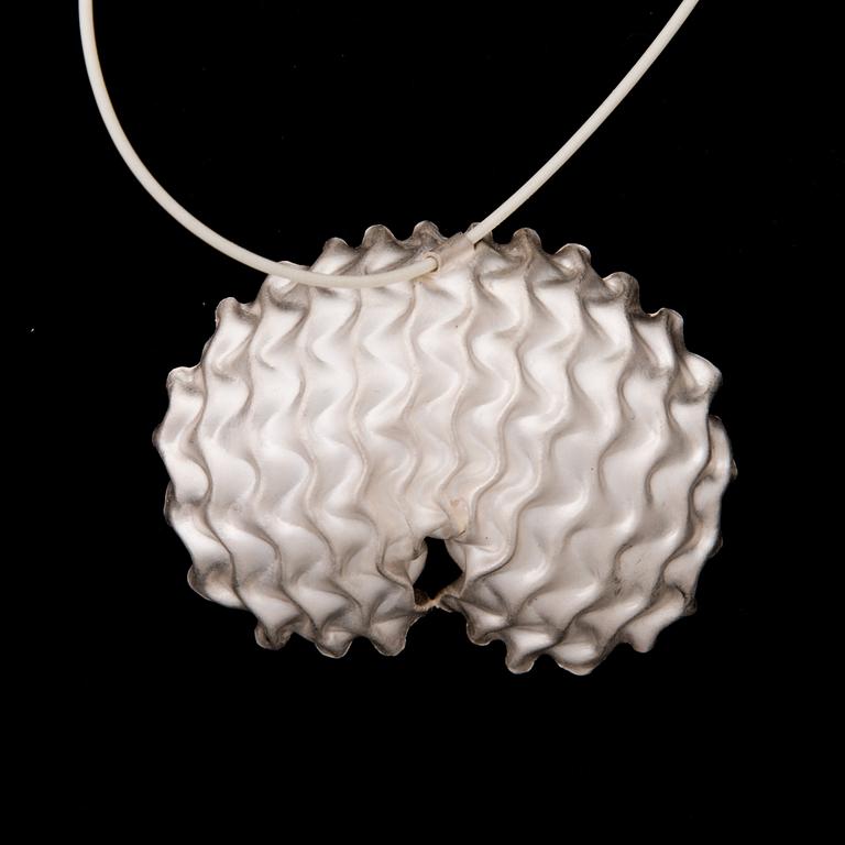 A NECKLACE, "Shelter", etched white silver, white rubber band, 2010.