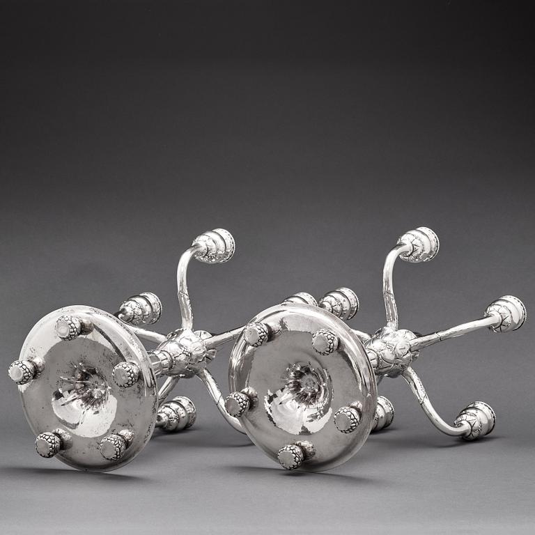 Georg Jensen, a pair of 830/1000 silver five light candelabra, Copenhagen 1920, design nr 200.