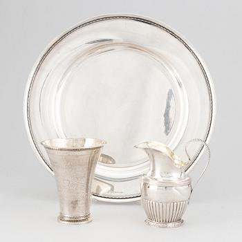 A silver creamer, beaker, and platter, Sweden, 18-19th century.