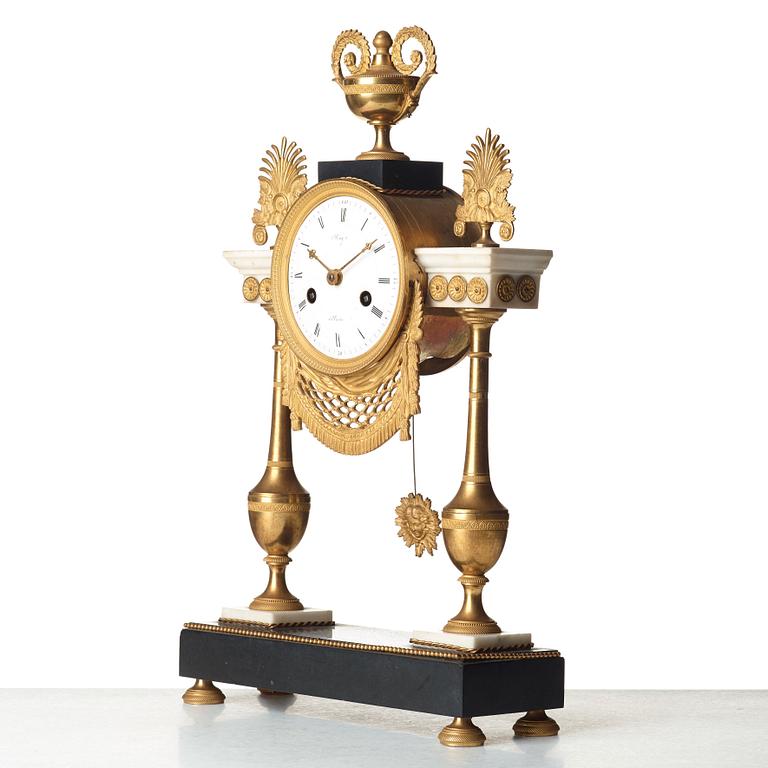 A Louis XVI circa 1790 mantel clock.