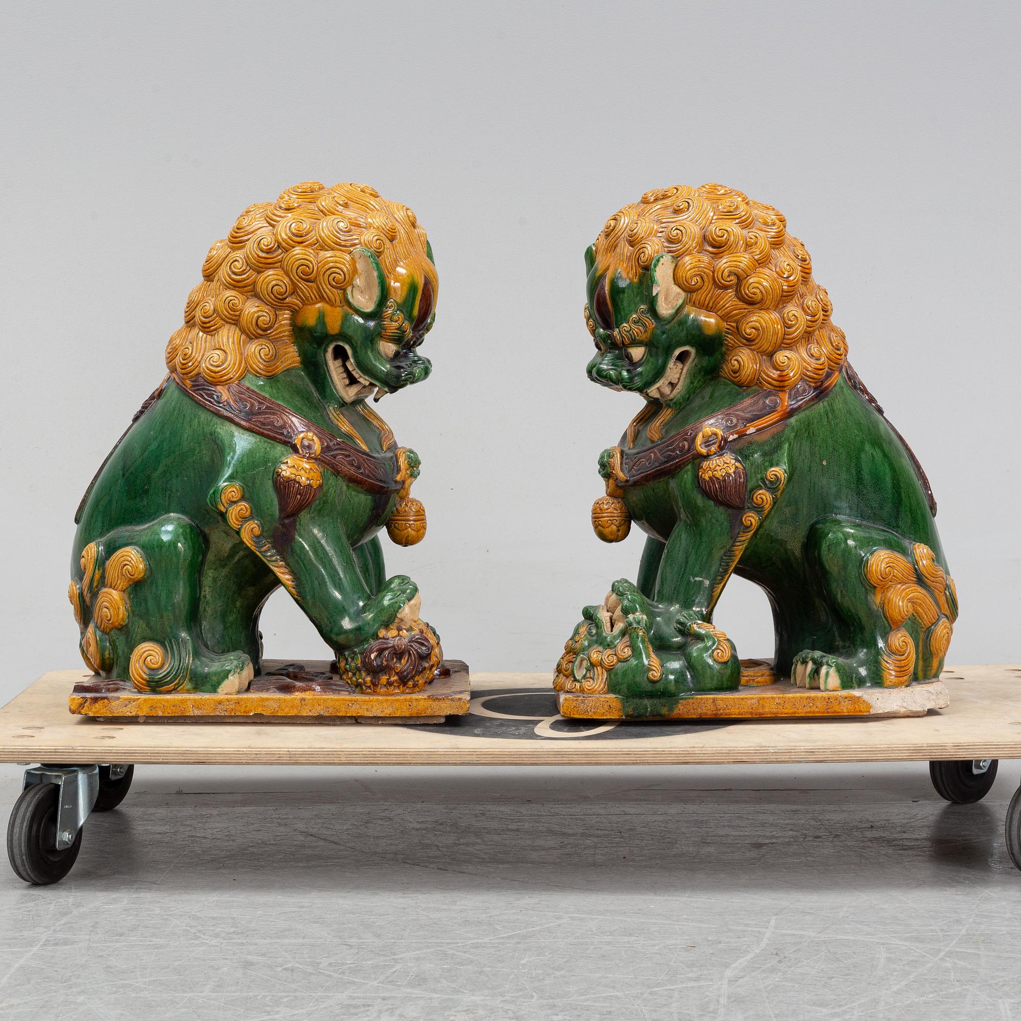 A pair of sancai-glazed chinese buddhist lions or guardian lions, early 20th century.