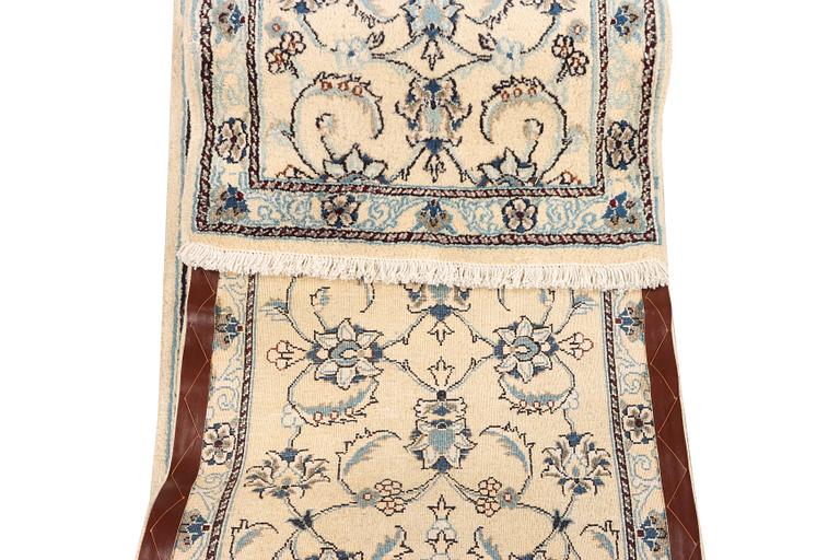A Nain runner, part silk, c. 288 x 64 cm.
