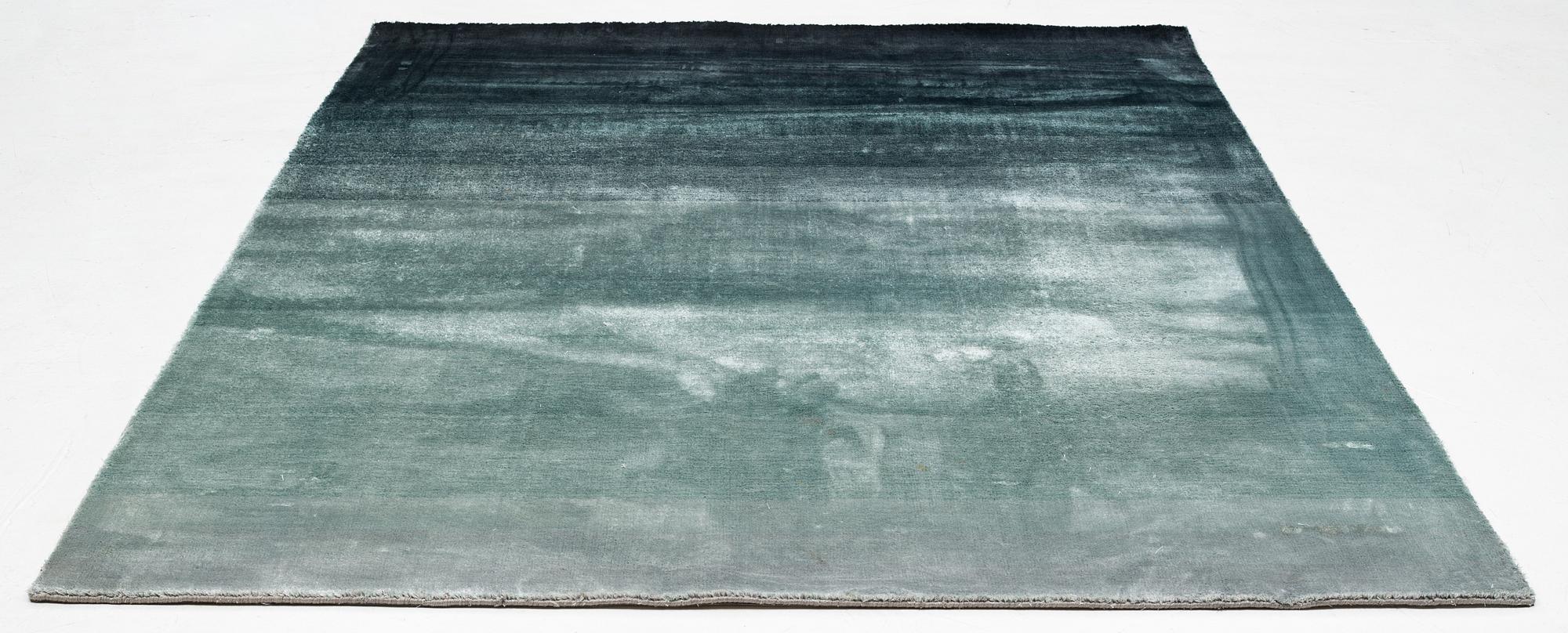 A Designers Guild carpet 'Capisoli teal', ca 205 x 300 cm.