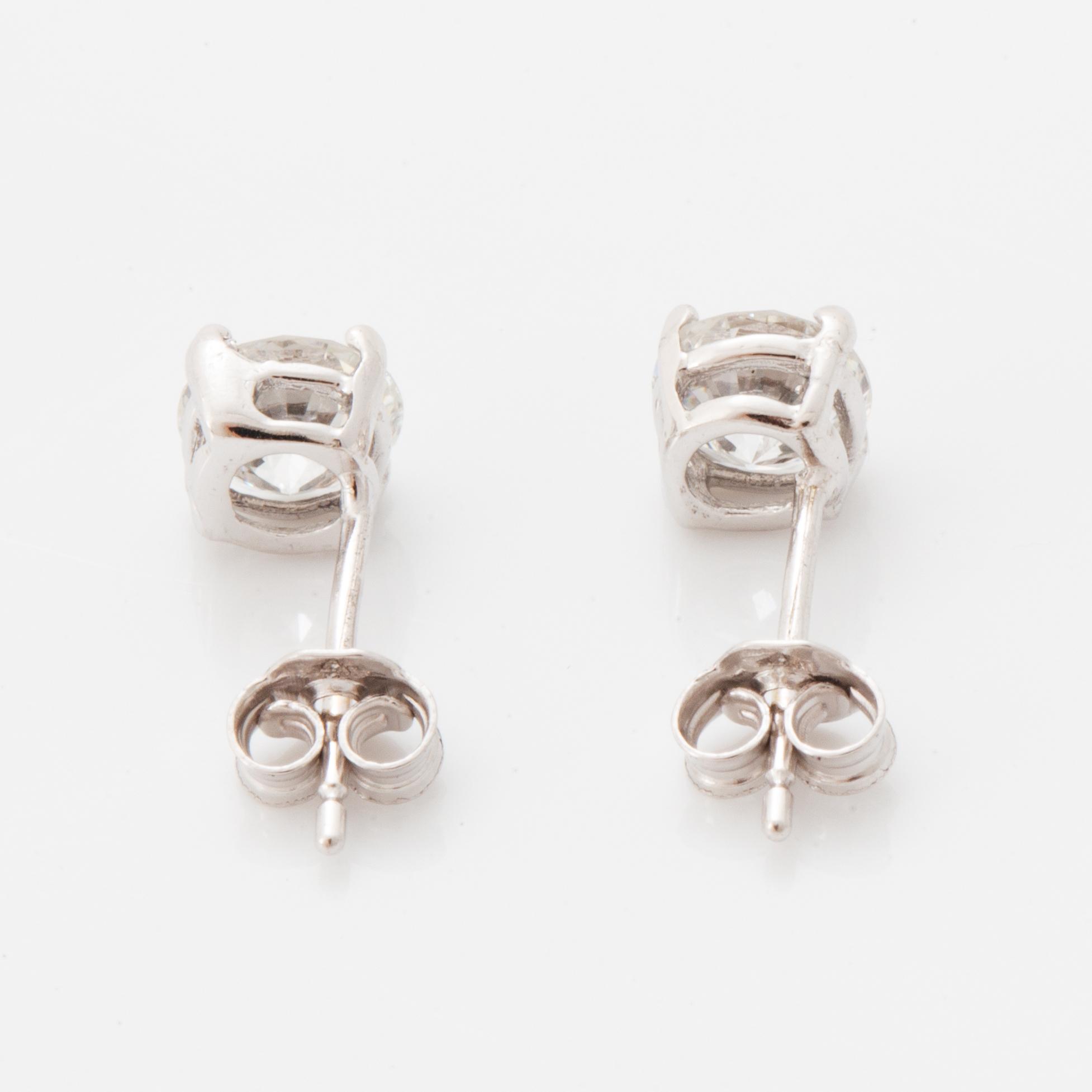 Brilliant-cut diamond stud earrings.
