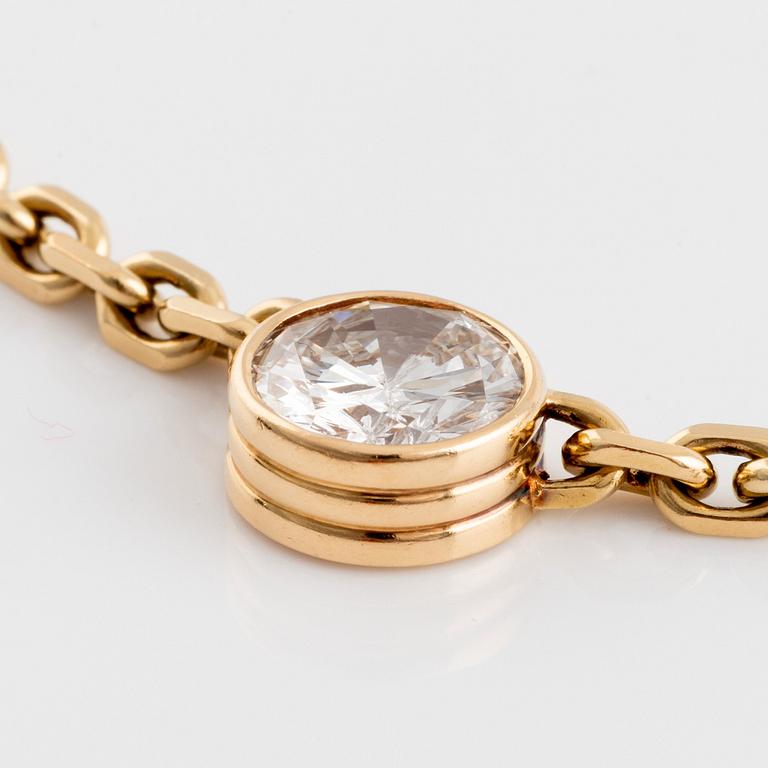 An 18K gold necklace set with an old-cut diamond.