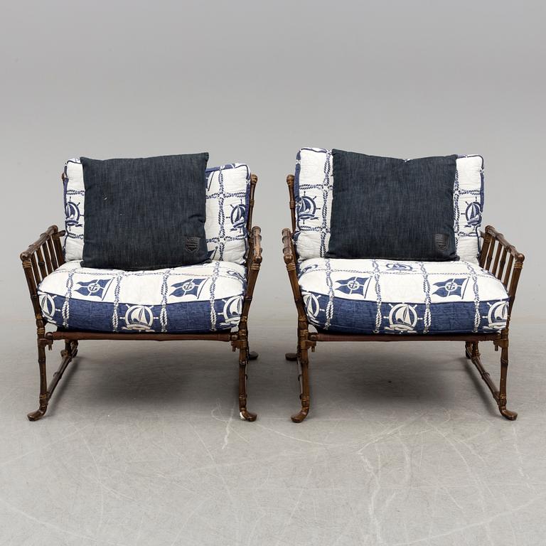 A Pair of contemporary garden easy chairs in metal imitating bamboo.