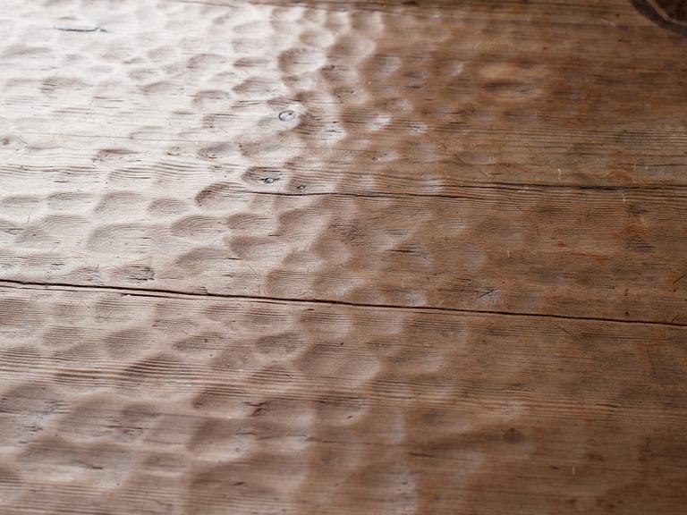 Gustaf Fjaestad, an Art Nouveau carved pine table, Arvika Sweden 1914, a double to the table in the Thiel Collection,