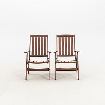 A set of five stained wood garden chairs from KWA around year 2000.