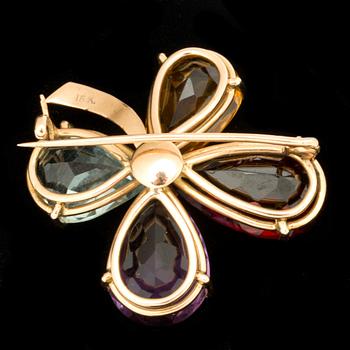 An aquamarine, amethyst, citrine and garnet brooch.