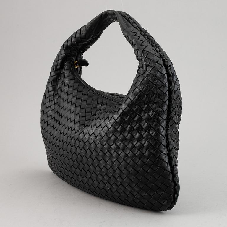 Bottega Veneta, a black leather bag.