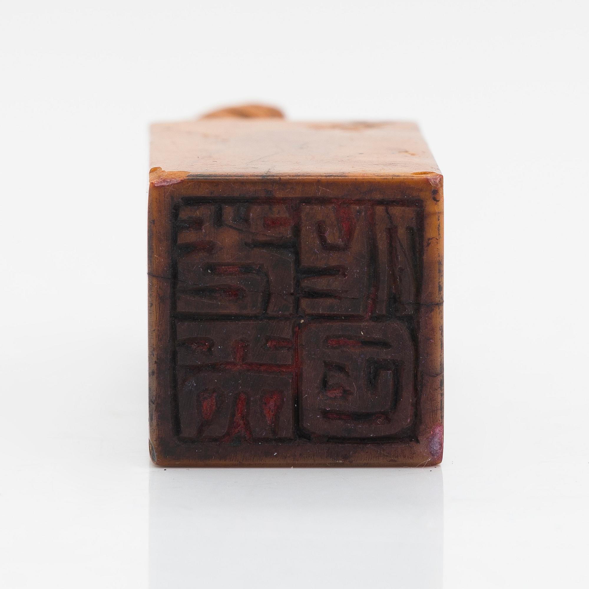 Two pieces of carved agalmatolite, sculpture and seal,one with stamp. China, mid-20th century.