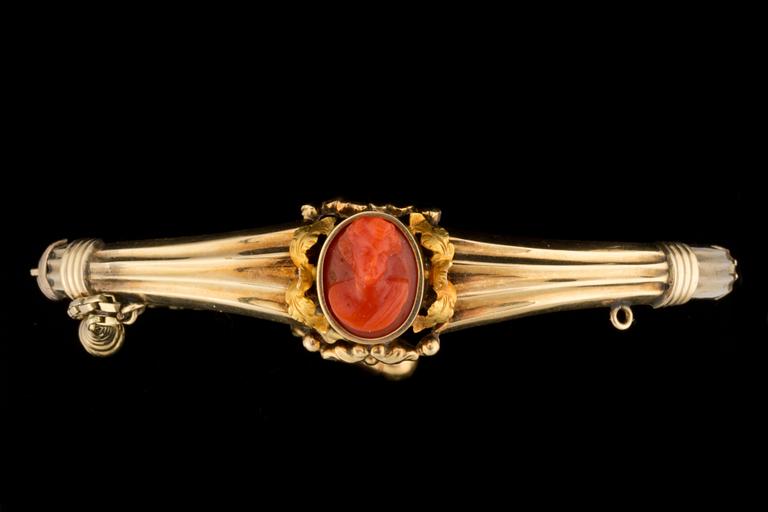 A carved coral cameo bracelet.