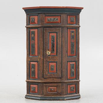 A Swedish provincial corner cabinet, dated 1790.