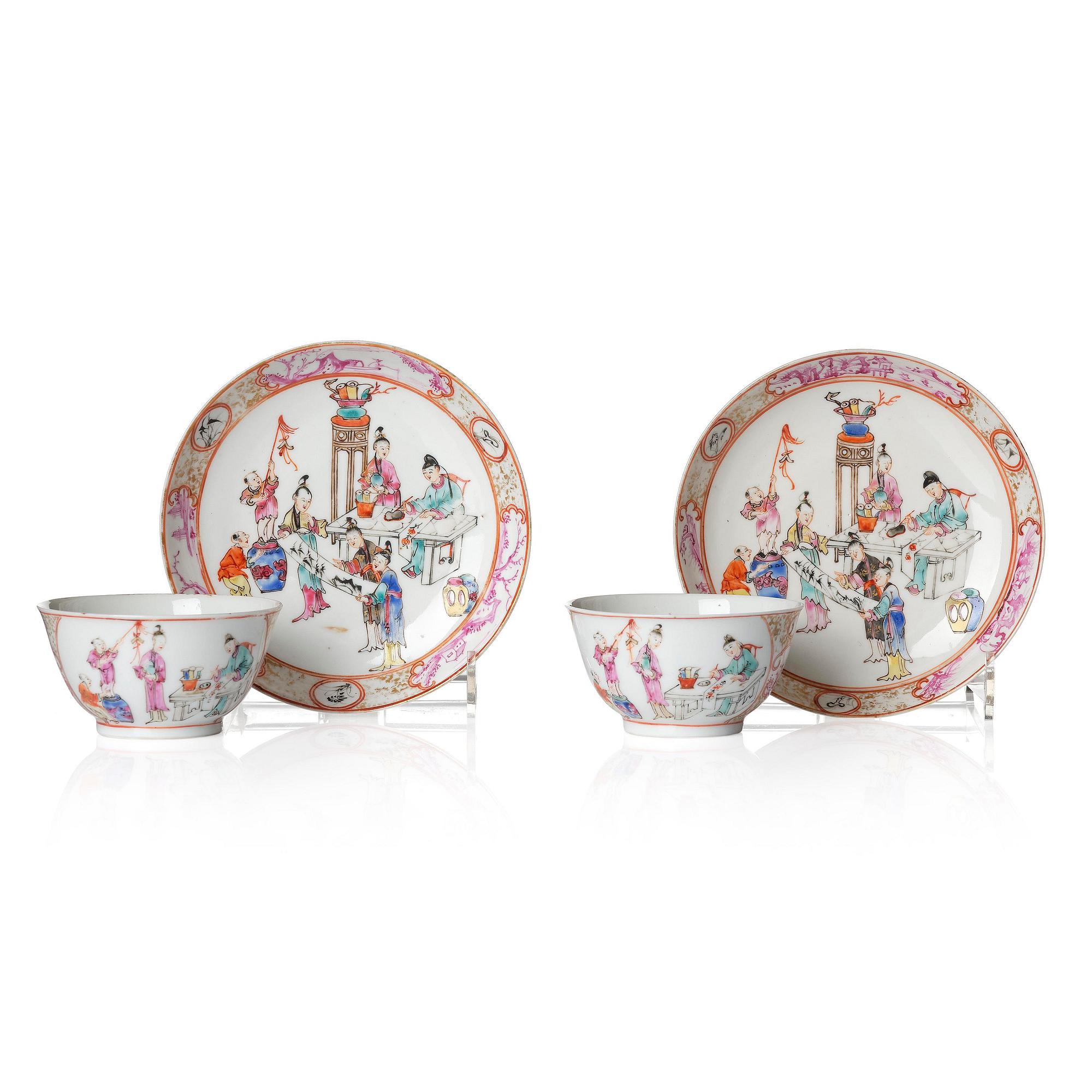 A pair of famille rose 'figural' tea cups with saucers, Qing dynasty, Qianlong (1736-95).