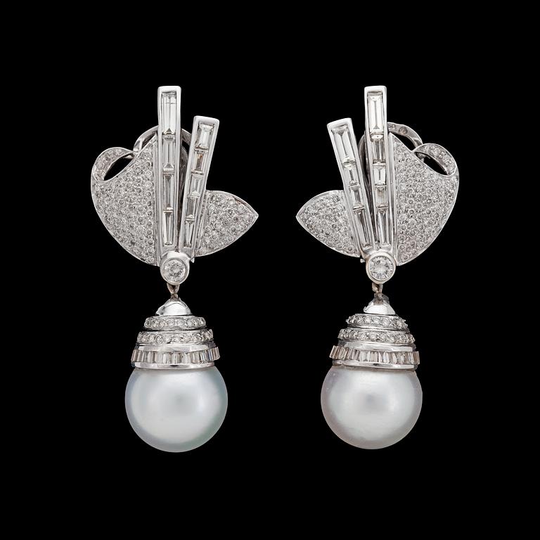 A pair of cultured South sea pearl and diamond earrings, tot. 5.65 cts.