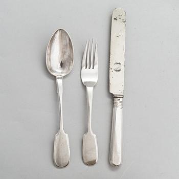 A Russian silver milk jug, and a silver fork, knife and spoon, Saint Petersburg 19th century.