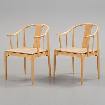 A pair of Hans J Wegner 'China' chairs, Fritz Hansen, Denmark 1987.