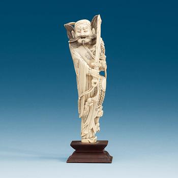 1556. An carved ivory sculpture of a guardsman, China, early 20th Century.
