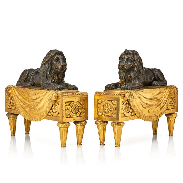 A pair of Louis XVI gilt and patinated bronze chenets.