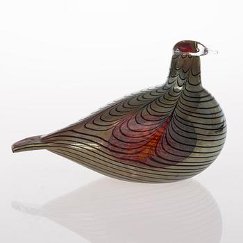 A glass bird, signed O. Toikka Nuutajärvi.